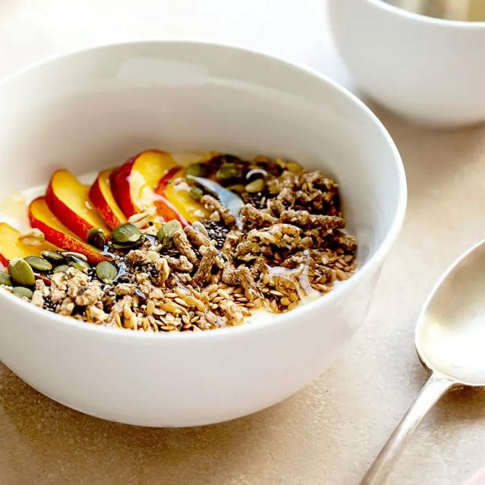 oatmeal breakfast with fruit and seeds