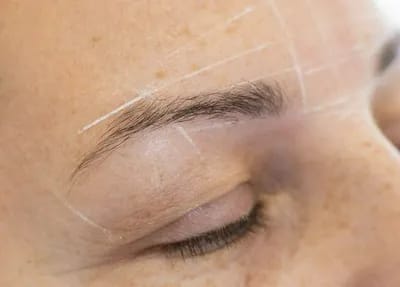 woman-getting-eyebrows-filled