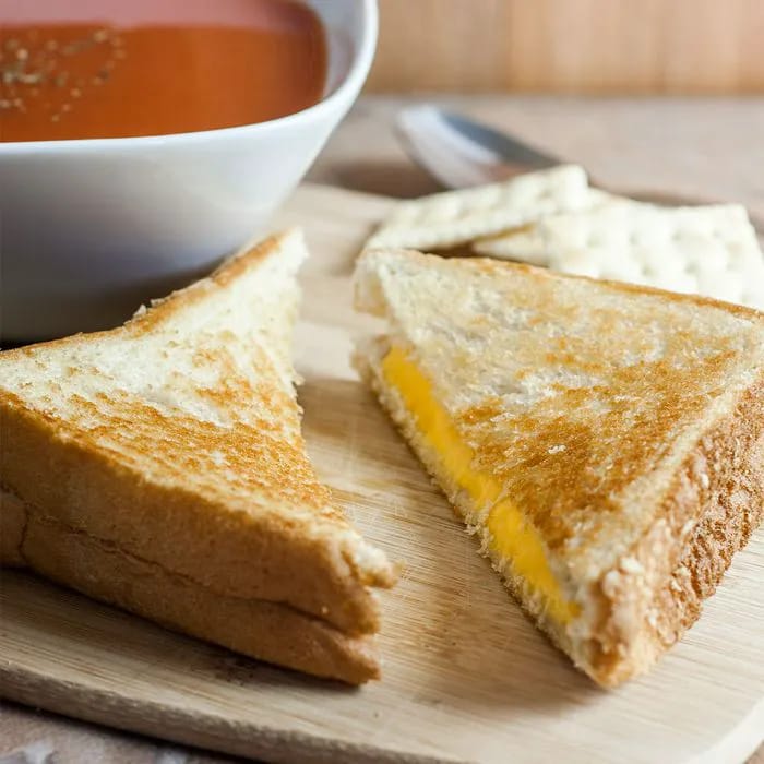 "Grilled cheese sandwich with tomato soup"