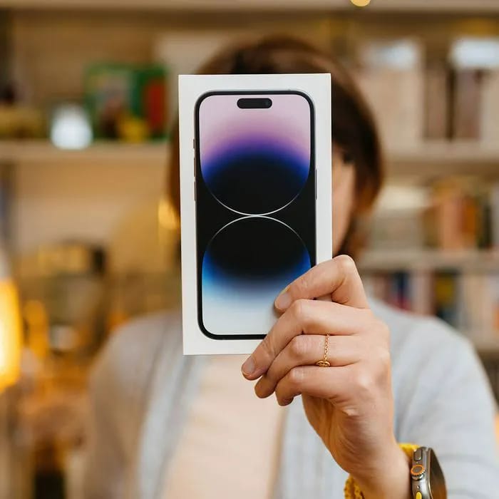 woman-holding-iphone-box