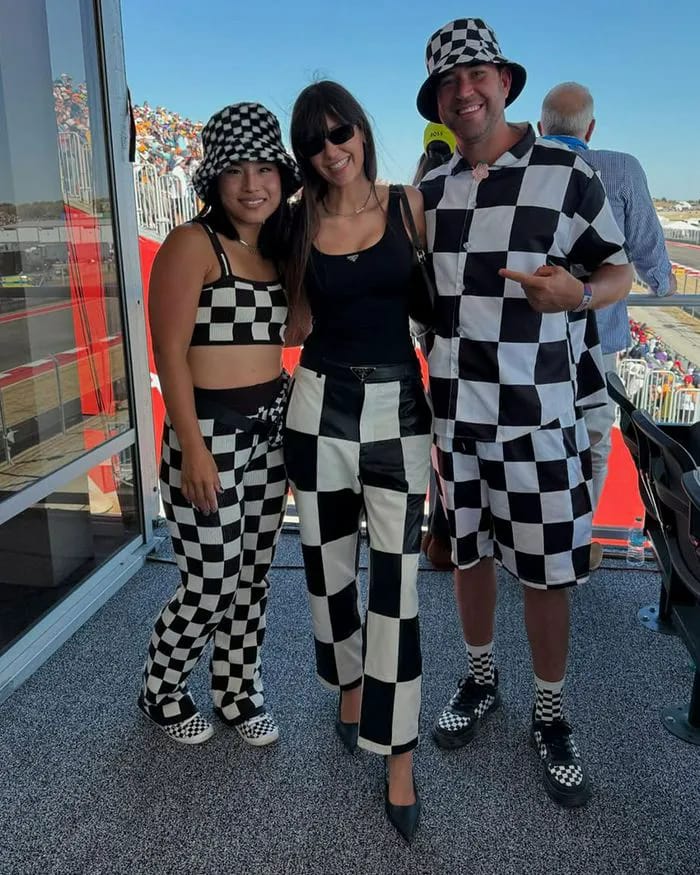 "Nina Dobrev in checkered outfit at Formula 1"