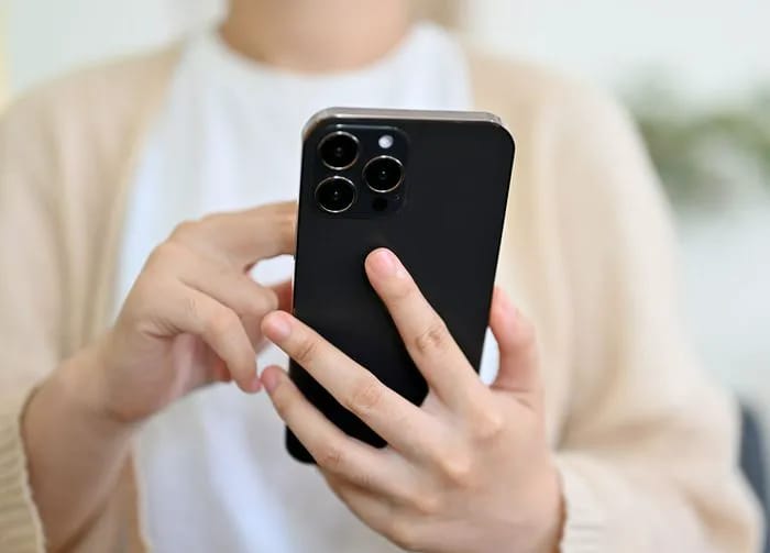 woman-using-black-iphone