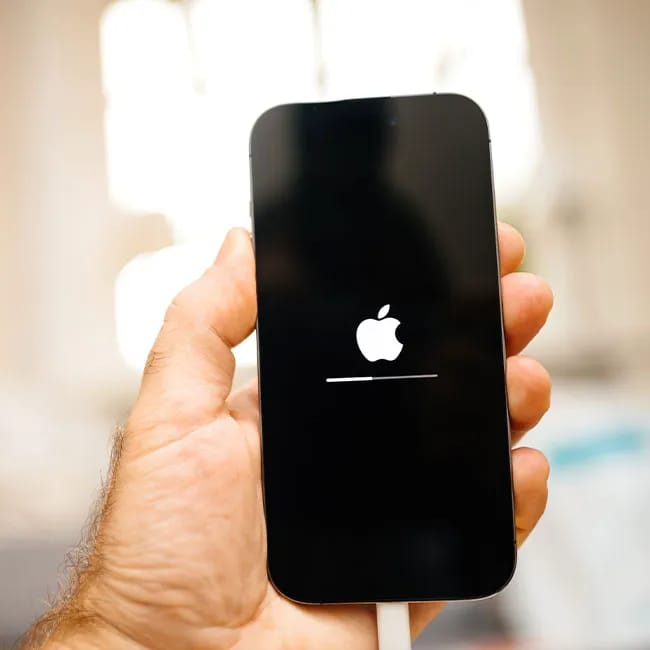 iPhone charging with a lightning cable on a surface