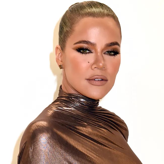 Khloé Kardashian presenting her outfit at CFDA Fashion Awards.