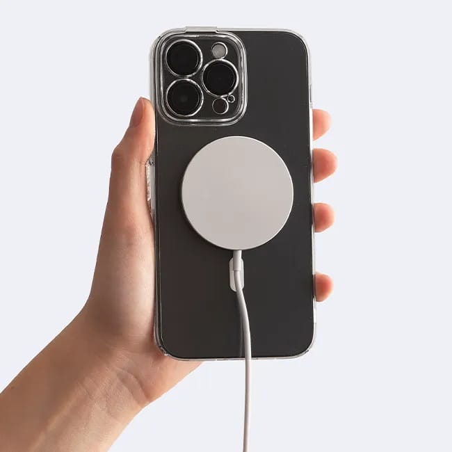 iPhone charging with a lightning cable on a table
