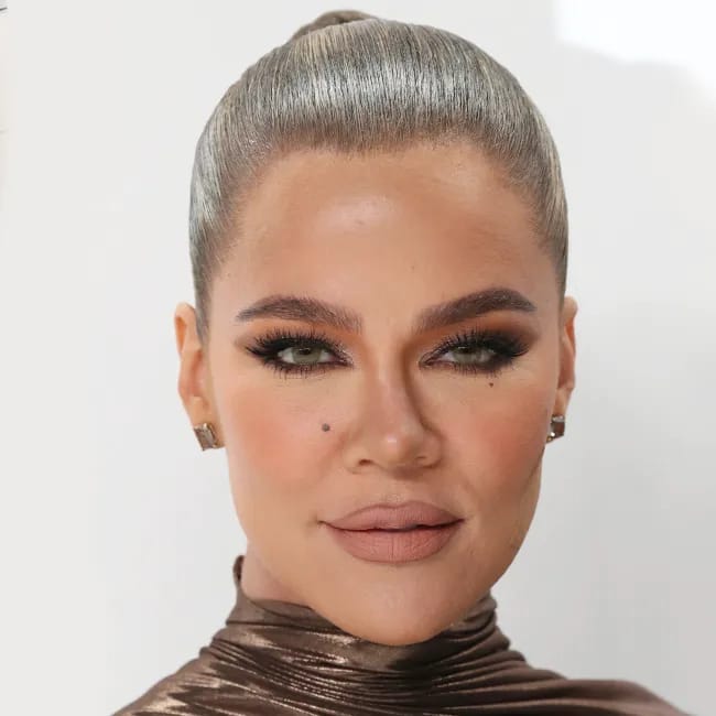 Khloé Kardashian posing elegantly at the CFDA Fashion Awards.