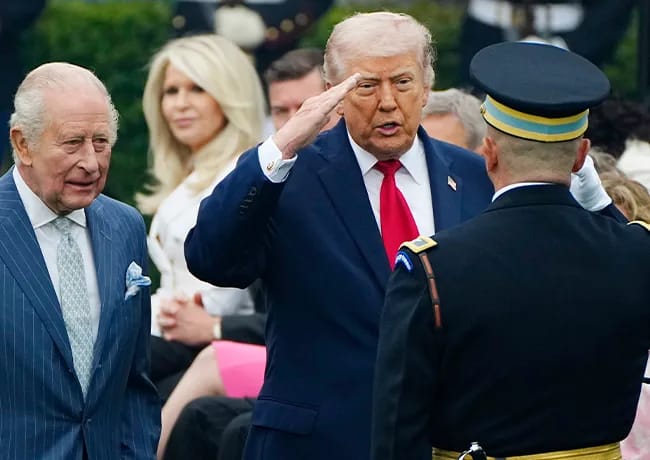 Donald Trump cutting in front of Queen Camilla shaking hands state visit