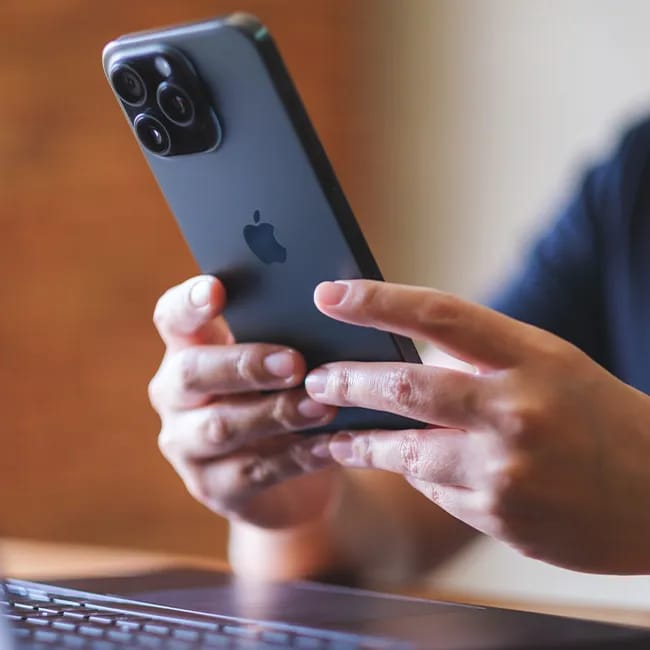 Typing on iPhone with focus on screen