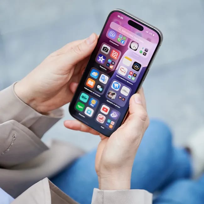 Woman confidently holding her iPhone.
