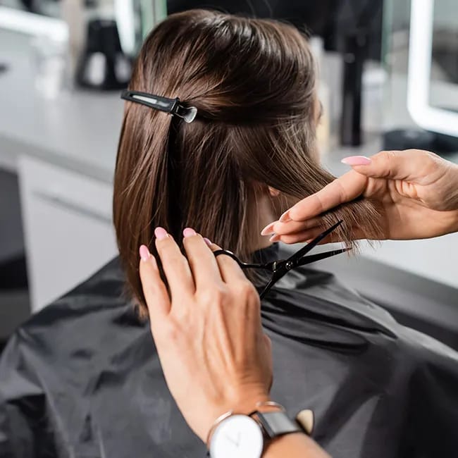 Getting a lob haircut at a trendy salon.