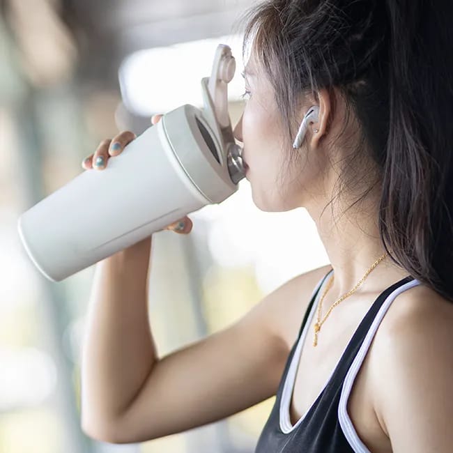 Woman enjoying a nutritious protein drink.