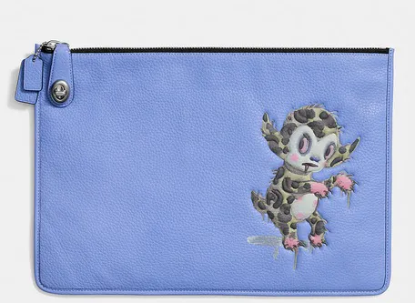 coach x baseman buster le fauve xl turnlock folio Image from SHEfinds