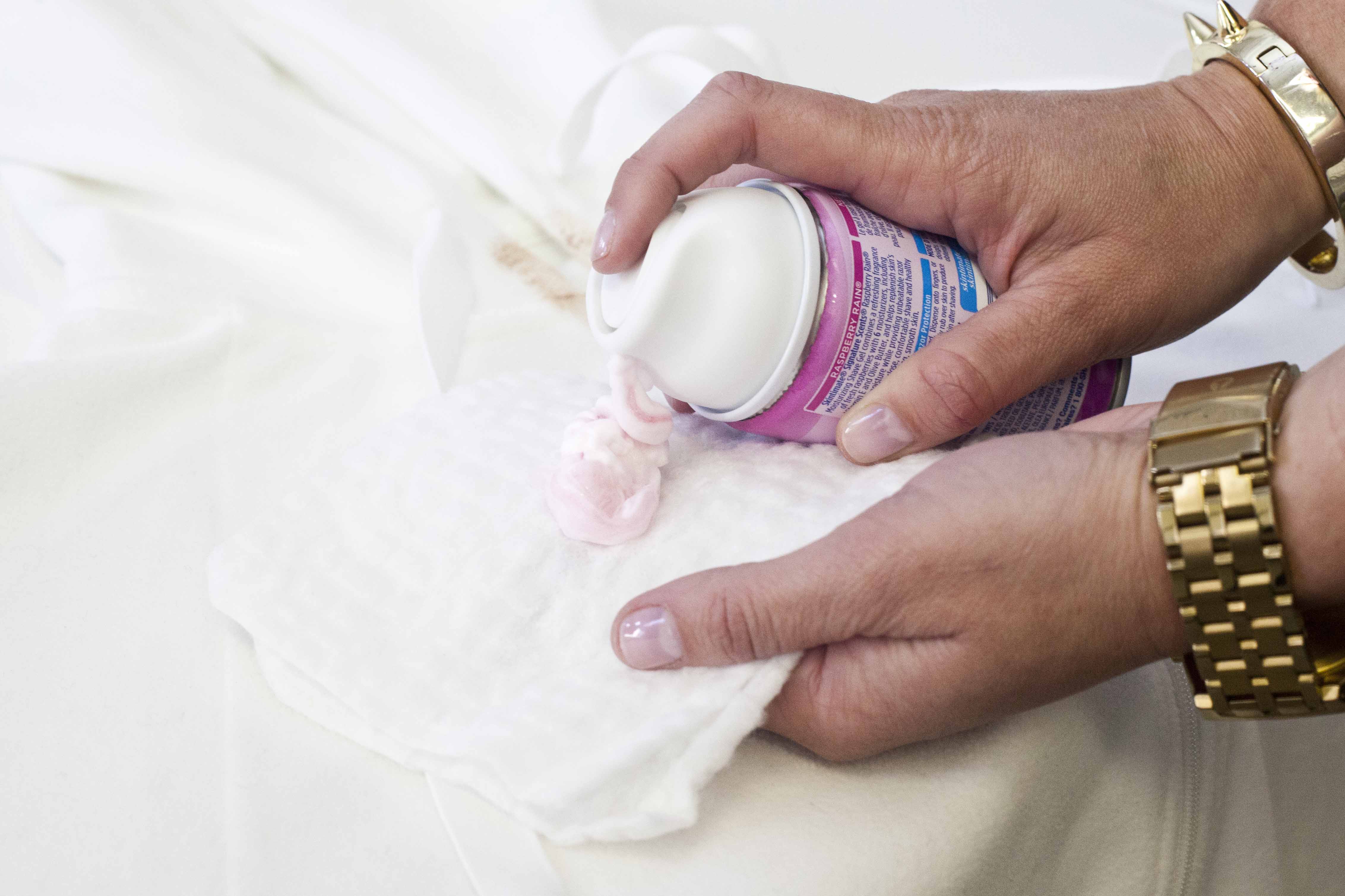 Step 2: Apply a dollop of shaving cream to a white cloth or rag.