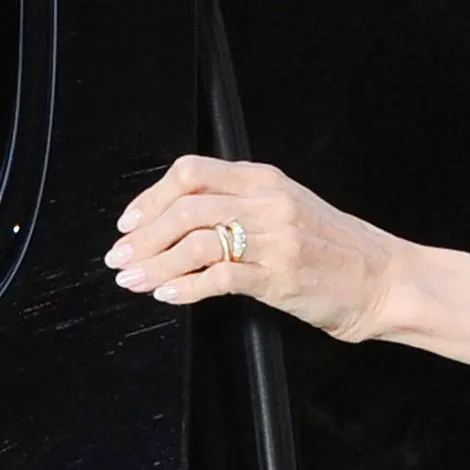 Angelina Jolie showcasing a bold and glamorous ring.
