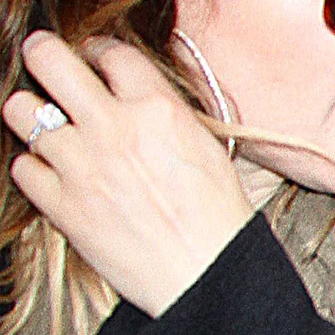 Drew Barrymore wearing a vintage-inspired diamond ring.