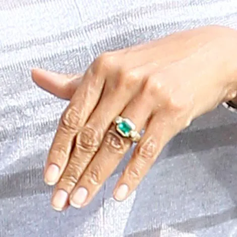Halle Berry showcasing an elegant diamond ring.