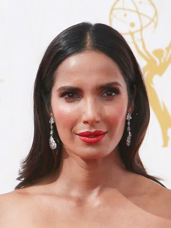 Padma Lakshmi presenting a dish on a cooking show.