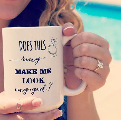 Use props. "Using props for engagement announcement photo"