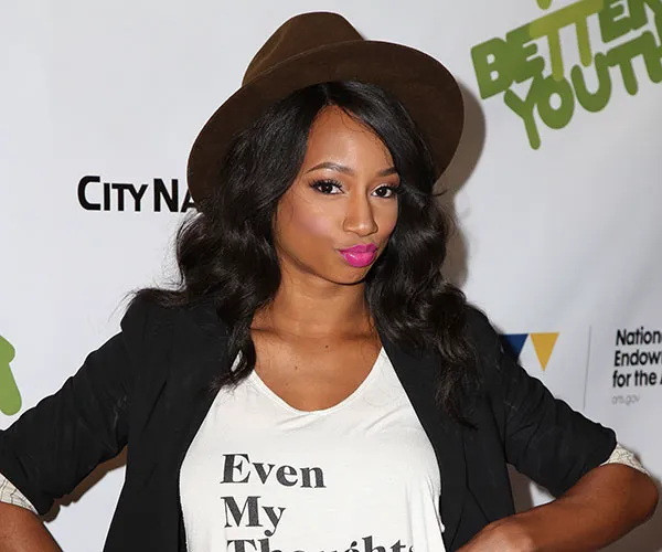 Monique now: Recent photo of Monique Coleman reflecting her current style.