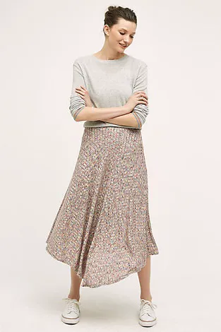 Chic evening gown with a flowing silhouette and sparkling embellishments.