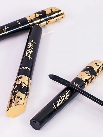 Piling on coat after coat of mascara.