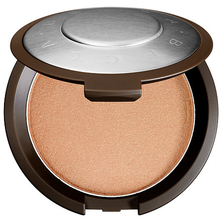 BECCA Shimmering Skin Perfector Pressed Highlighter in the shade Champange Pop