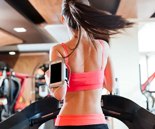 girl running on treadmill