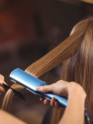 woman getting hair done