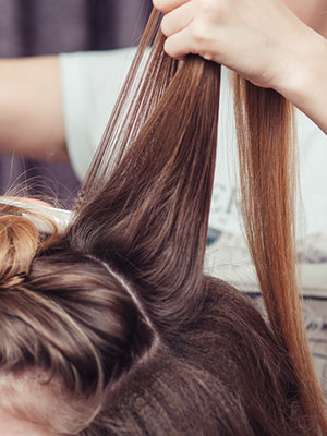 woman getting hair done