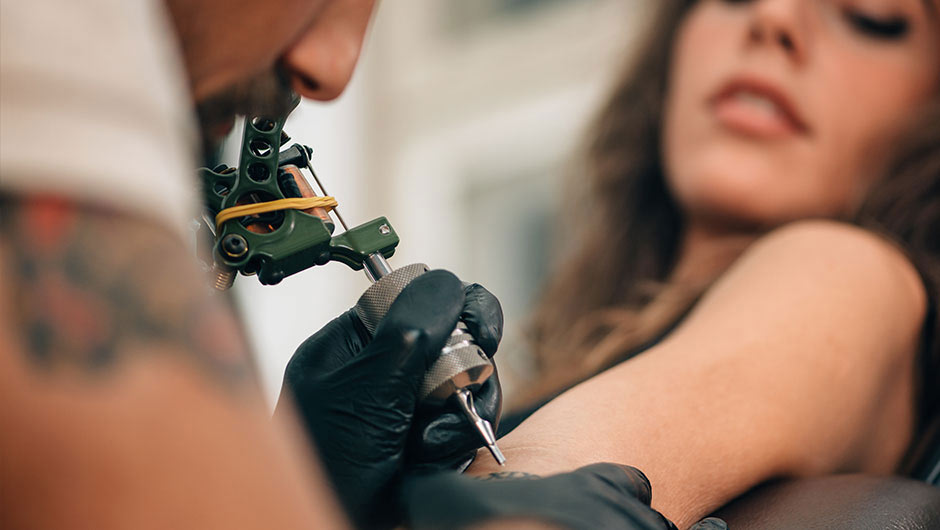 woman getting tattoo