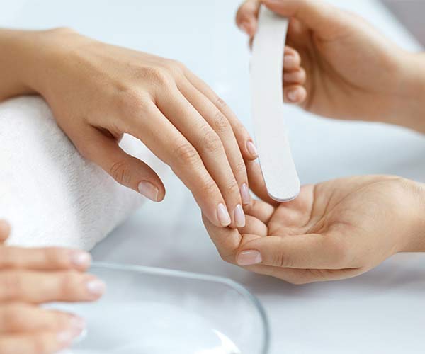 woman getting manicure