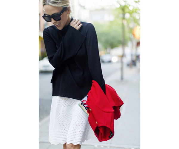 damsel in dior black sweater white skirt red jacket