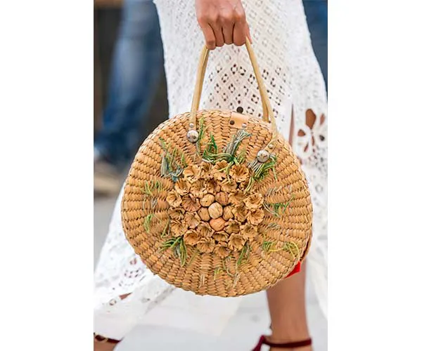 Chic straw bag with a unique woven pattern.