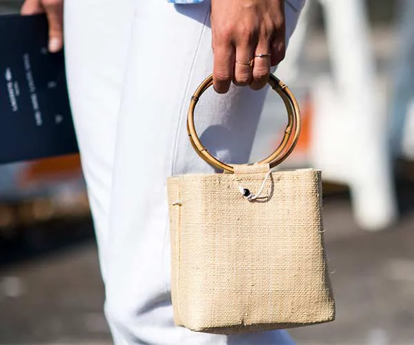 Elegant straw bag perfect for casual summer outfits.