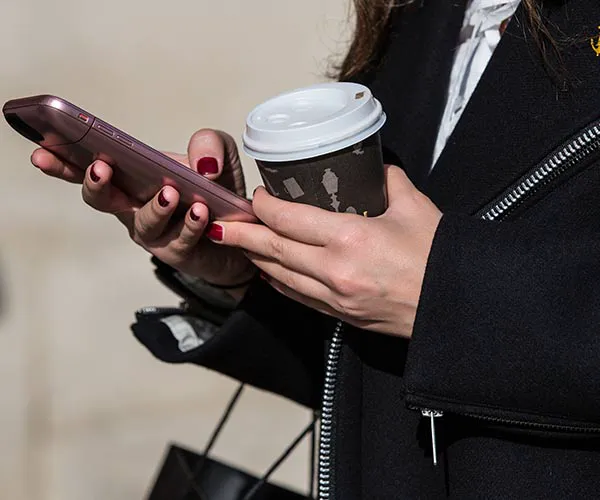 What To Do When You've Damaged Your Phone woman using phone