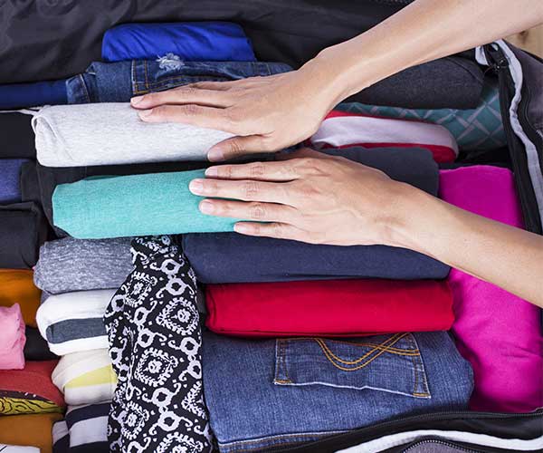 woman packing suitcase