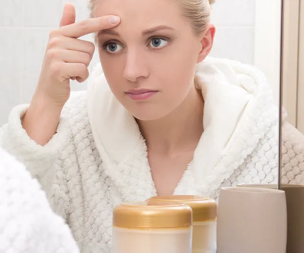 woman picking zit