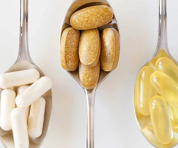 various supplements in spoons