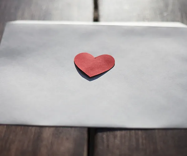 Write A Love Letter Happy groom celebrating at a wedding ceremony.