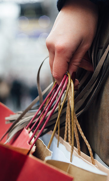 woman holding shopping bags 