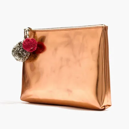 Madewell pompom zip pouch in vibrant colors on display.