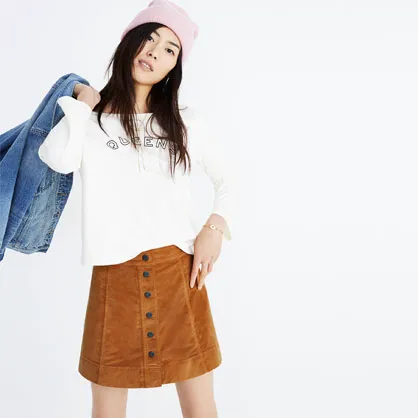 Madewell velveteen Metropolis snap skirt in chic fashion layout.