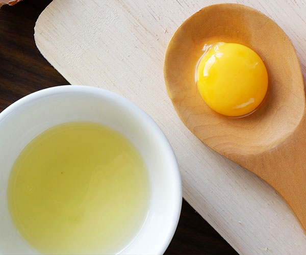 separated egg yolk and egg white