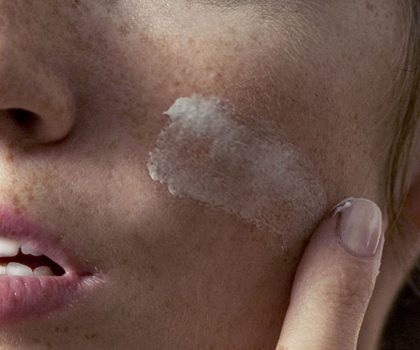 Creams For Hyperpigmentation woman applying cream