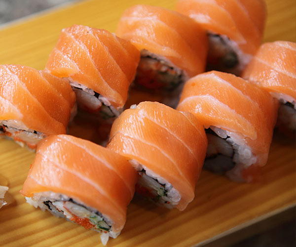 salmon sushi rolls on a plate