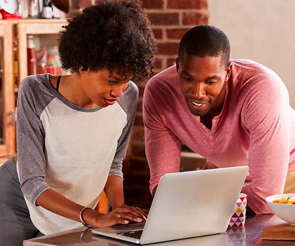 Couple in front of laptop