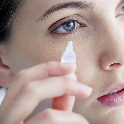 woman applying eye gel