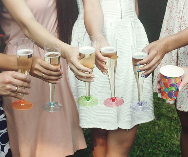 women toasting their cocktails