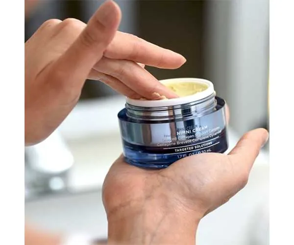 woman using HydroPeptide nimini cream