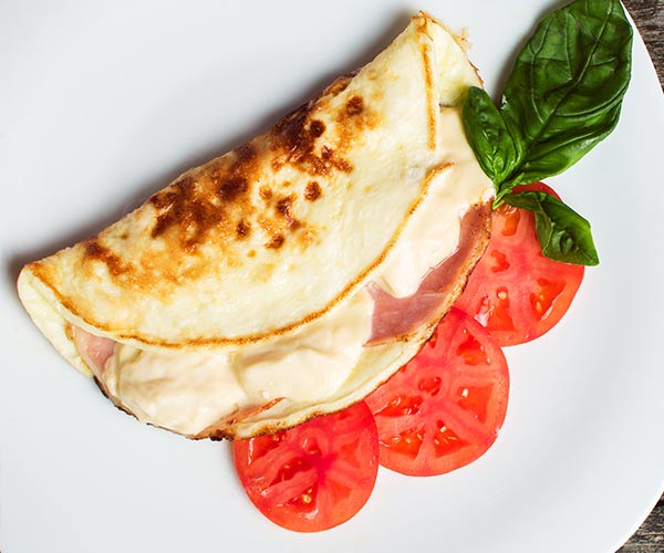 omelet with tomatoes on a plate